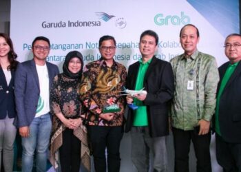 Berikan Nilai Tambah ke Pelanggannya, Garuda Indonesia dan Grab Jalin Kerja Sama