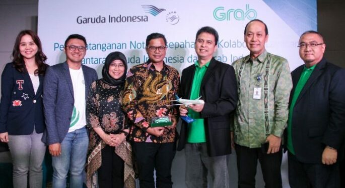 Berikan Nilai Tambah ke Pelanggannya, Garuda Indonesia dan Grab Jalin Kerja Sama