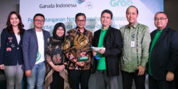 Berikan Nilai Tambah ke Pelanggannya, Garuda Indonesia dan Grab Jalin Kerja Sama