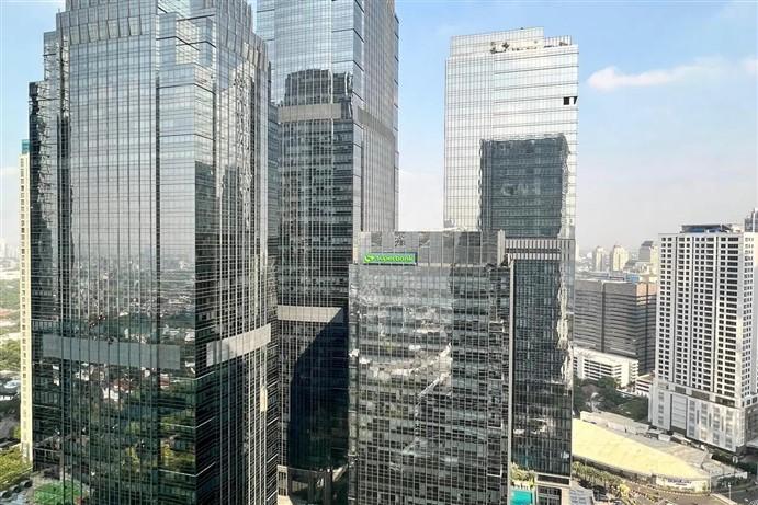 Grab Konsolidasikan Saham Superbank